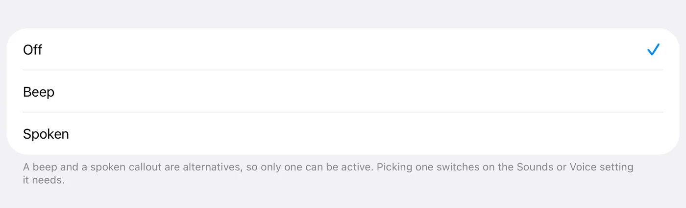 The partial-distance alert picker: Off (ticked), Beep and Spoken. The footer explains that a beep and a spoken callout are alternatives, so only one can be active, and that picking one switches on the Sounds or Voice setting it needs.